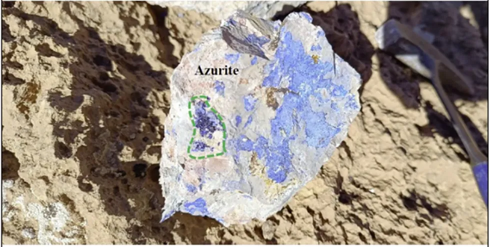 Azurite mineral on rocky surface, highlighted with a green dashed line. from Steadright Critical MIneral's Copper Valley project