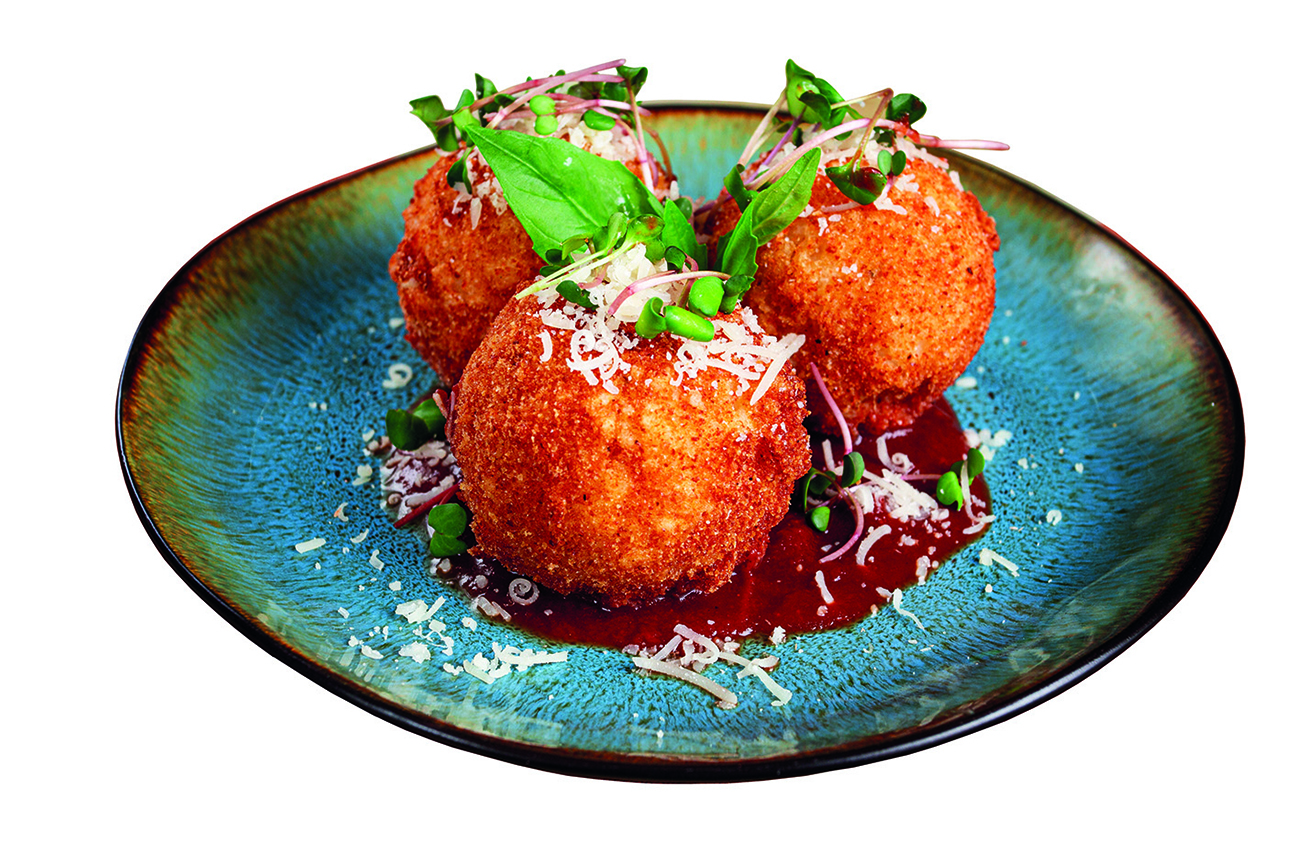 Arancini and fritto misto on a blue plate