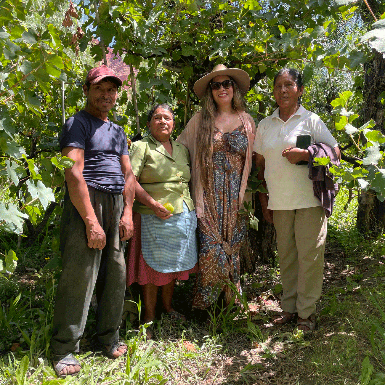 Winemaker Patricia Mendoza with farmers in the Mollepampa vineyard in Cinti