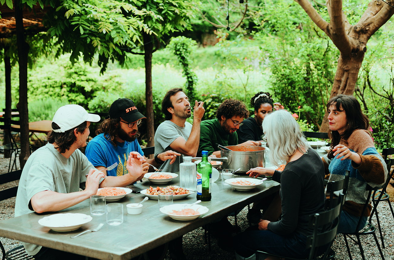 seven people having lunch around a table
