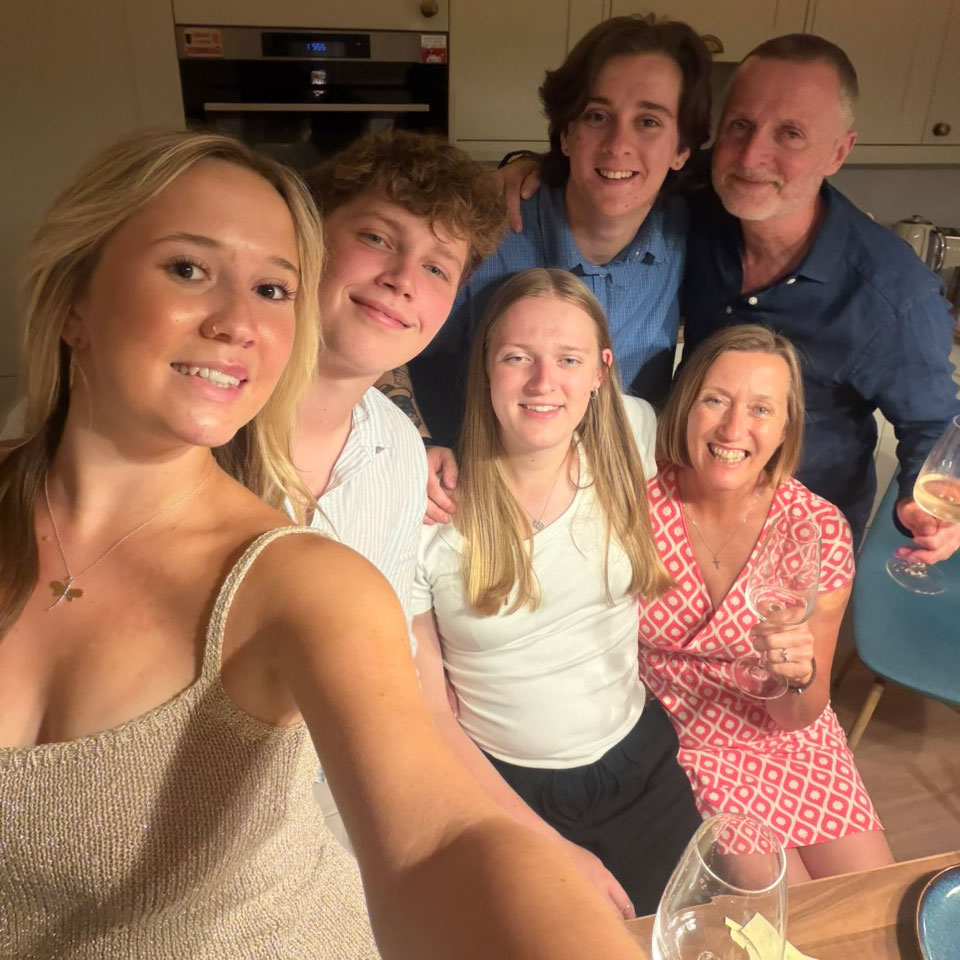 Emily Hawtin, left, with her boyfriend and family