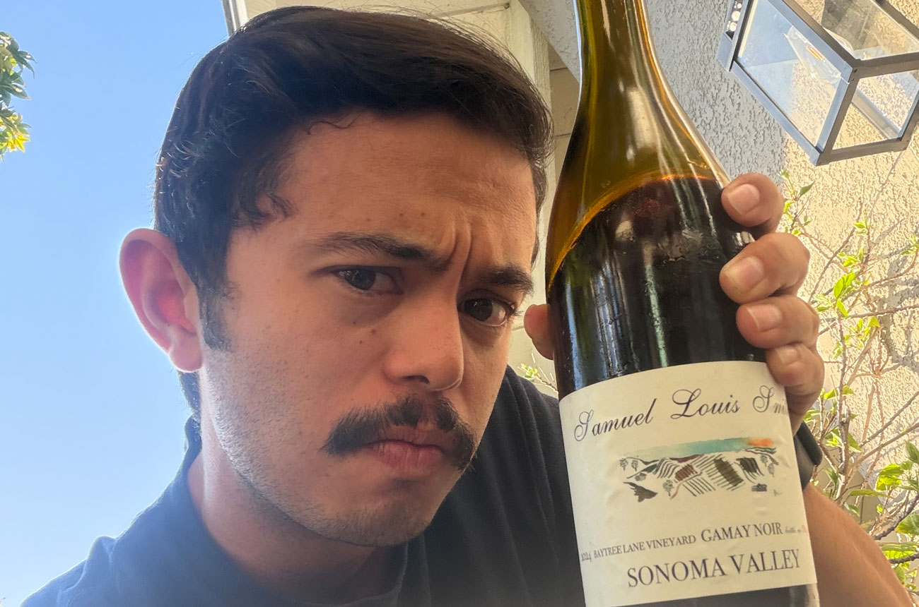 Alex Padilla with a bottle of Samuel Louis Smith Baytree Lane Vineyard Gamay 2024 from Sonoma Valley